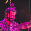 Drummer heavily concentrated in drumming